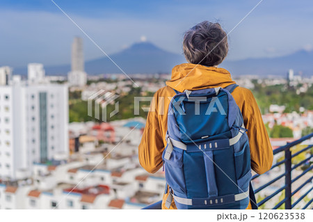 Male tourist in front of Popocatepetl Volcano, Mexico. Adventure, natural exploration, and travel experience concept 120623538