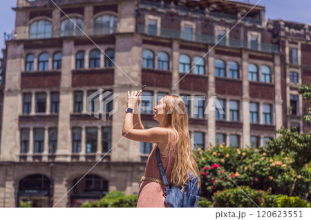 Female tourist in the central square of Mexico City, Zocalo. Cultural exploration, travel, and historic architecture concept Female tourist in the central square of Mexico City, Zocalo. Cultural exploration, travel, and historic architecture concept 120623551