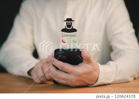 Man answering the incoming call. Phone call was from an unknown number. Concept of scam, fraud with a mobile phone from the criminal. Call center gang or stranger. Hoax person with a fake identity. Man answering the incoming call. Phone call was from an unknown number. Concept of scam, fraud with a mobile phone from the criminal. Call center gang or stranger. Hoax person with a fake identity. 120624378