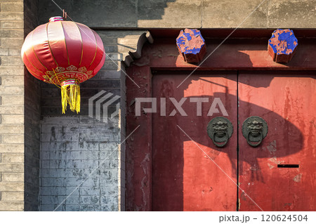 Ancient old door in China with door knocker. Ancient old door in China with door knocker. 120624504