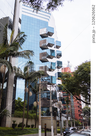 Urban modern design featuring greenery and reflective glass Urban modern design featuring greenery and reflective glass 120626062