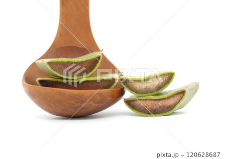 Close Up of Aloe Vera Leaf Slices on Wooden Spoon Isolated on White Background 120628687