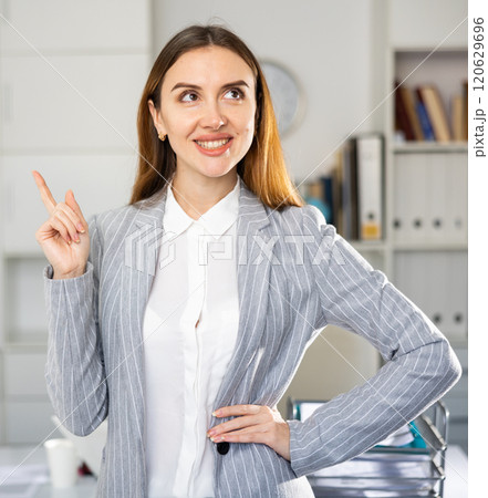 Woman manager expresses various positive emotions in modern office Woman manager expresses various positive emotions in modern office 120629696