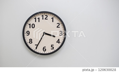 Classic Black-Edged Clock on White Background at 15.35/03.35 - Perfect for Time Management and Text Space 120630028