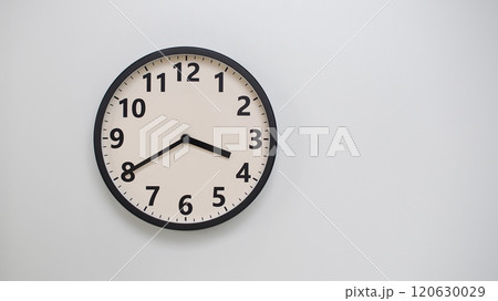 Classic Black-Edged Clock on White Background at 15.40/03.40 - Perfect for Time Management and Text Space 120630029