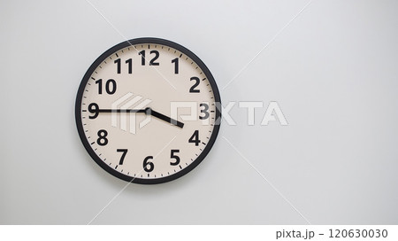 Classic Black-Edged Clock on White Background at 15.45/03.45 - Perfect for Time Management and Text Space Classic Black-Edged Clock on White Background at 15.45/03.45 - Perfect for Time Management and Text Space 120630030