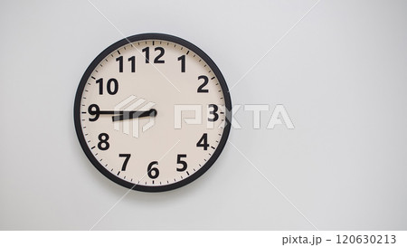 Classic Black-Edged Clock on White Background at 20.45/08.45 - Perfect for Time Management and Text Space 120630213