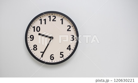 Classic Black-Edged Clock on White Background at 21.35/09.35 - Perfect for Time Management and Text Space 120630221