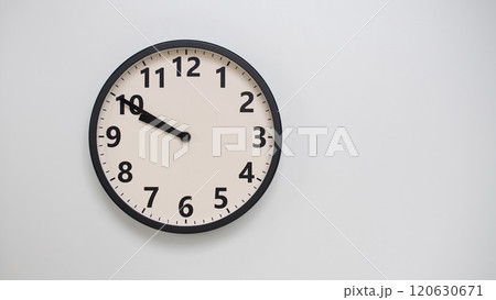 Classic Black-Edged Clock on White Background at 21.50/09.50 - Perfect for Time Management and Text Space Classic Black-Edged Clock on White Background at 21.50/09.50 - Perfect for Time Management and Text Space 120630671