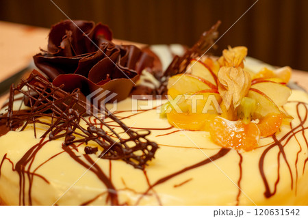 An Elegant Chocolate and Fruit Cake with Beautiful Decorative Toppings for any occasion An Elegant Chocolate and Fruit Cake with Beautiful Decorative Toppings for any occasion 120631542