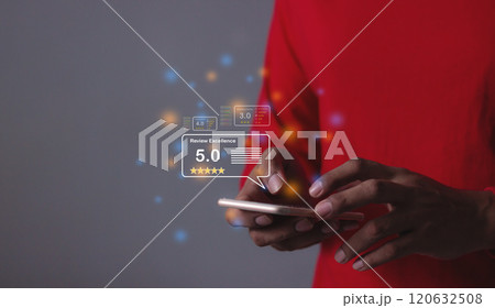 Review Excellence, Young Man hand using smartphone mobile with five star to review and give 5 stars  120632508