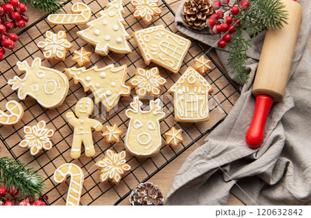 Christmas cookies cooling on a wire rack with festive decorations 120632842