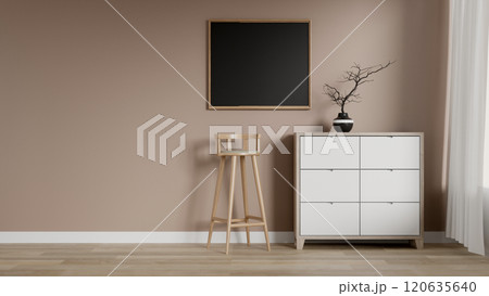 A minimalist room features a drawer, a stool, a picture frame, parquet flooring, and the beige wall. 120635640
