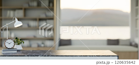 A close-up of a black marble desk with copy space set in a cozy living room or office. 120635642