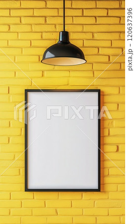 Framed white poster on yellow brick wall with industrial lamp 120637396