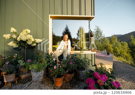 Woman Relaxing by Window in Garden Woman Relaxing by Window in Garden 120638906