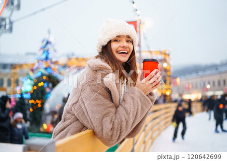 Woman enjoying winter moments. Festive Christmas fair, winter holidays concept. 120642699