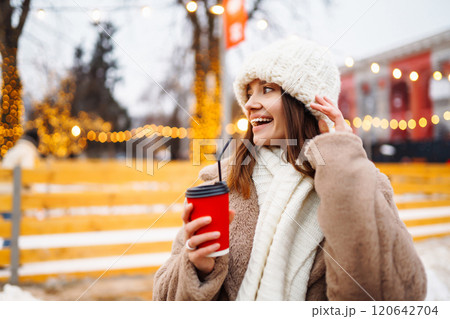 Woman enjoying winter moments. Festive Christmas fair, winter holidays concept. Woman enjoying winter moments. Festive Christmas fair, winter holidays concept. 120642704
