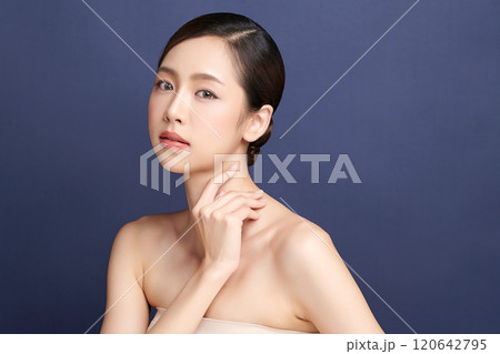 Beautiful young asian woman with clean fresh skin on blue background, Face care, Facial treatment, Cosmetology, beauty and spa, Asian women portrait. Beautiful young asian woman with clean fresh skin on blue background, Face care, Facial treatment, Cosmetology, beauty and spa, Asian women portrait. 120642795
