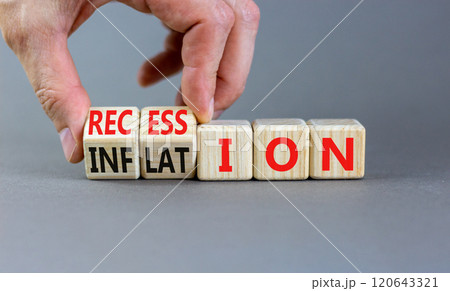 Inflation and recession symbol. Businessman turns wooden cubes and changes word Recession to Inflation. Beautiful grey table grey background. Business and inflation or recession concept. Copy space. 120643321