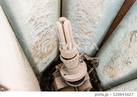 dusty halogen lamp inside street light 120643827