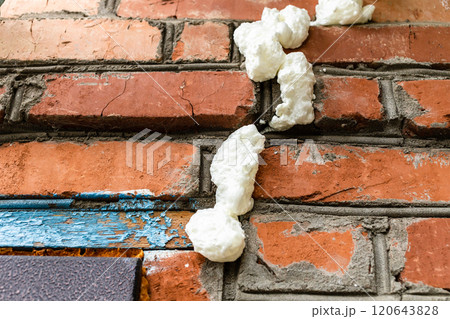 fresh construction foam filled cracks in brickwork fresh construction foam filled cracks in brickwork 120643828