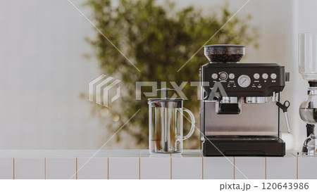 Coffee machine with french press on white tiled counter with blured cafe background, 3d render Coffee machine with french press on white tiled counter with blured cafe background, 3d render 120643986