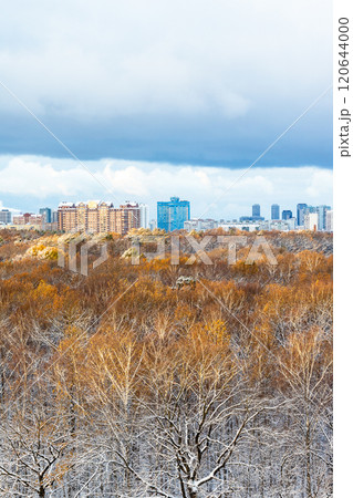 large blue cloud over snow-covered city park large blue cloud over snow-covered city park 120644000