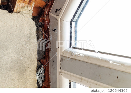 old broken wall after installing plastic window 120644565