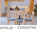 Coffee shops with tables are empty by noon. 120644766
