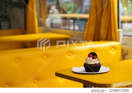 A sponge cake is on a table in a cafe 120647269