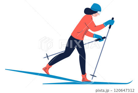 A woman is skiing down a slope with her skis on 120647312
