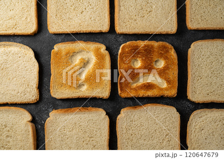 Gluten food, celiac disease, slice of toasted bread with sad face and question sign. Gluten sensitivty 120647679