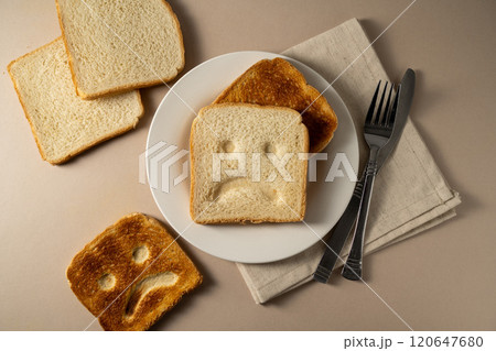 Gluten allergy, slice of fresh toast bread with sad face. Gluten free food. 120647680