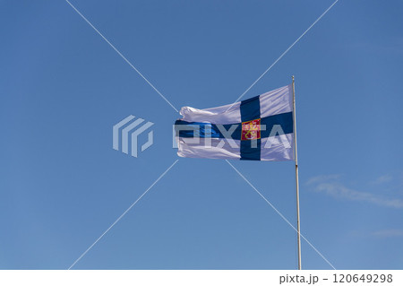 Finnish coat of arms on national flag in front of Helsinki cathedral on the Senate square 120649298