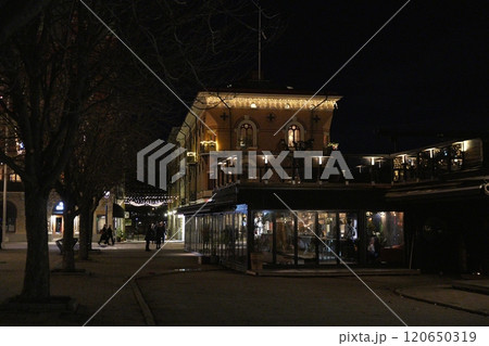 Nighttime Street in Sundsvall, Sweden, with Lit Cafes and Historic Architecture 120650319