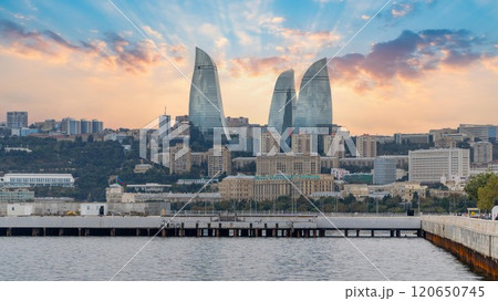 Baku's Flame Towers rise against the Caspian Sea, blending urban skyline with coastal beauty in the heart of Azerbaijan's capital. Baku's Flame Towers rise against the Caspian Sea, blending urban skyline with coastal beauty in the heart of Azerbaijan's capital. 120650745