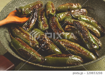 fried padron pepper, in a frying pan, with olive oil, and sea salt, homemade, no people. 120653208