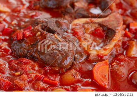 ossobuco stew with vegetables, knuckle on the bone with new potatoes, in tomato sauce,homemade, top view, no people, ossobuco stew with vegetables, knuckle on the bone with new potatoes, in tomato sauce,homemade, top view, no people, 120653212