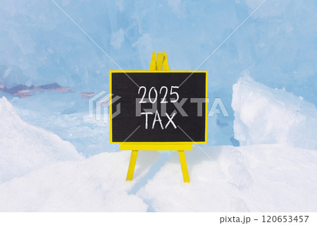 Planning 2025 tax new year symbol. Concept words 2025 Tax on beautiful yellow chalk blackboard. Beautiful Baikal lake blue ice background. Business 2025 tax new year concept. Copy space. Planning 2025 tax new year symbol. Concept words 2025 Tax on beautiful yellow chalk blackboard. Beautiful Baikal lake blue ice background. Business 2025 tax new year concept. Copy space. 120653457