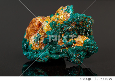 macro mineral stone Dioptase on a gray background macro mineral stone Dioptase on a gray background 120654059