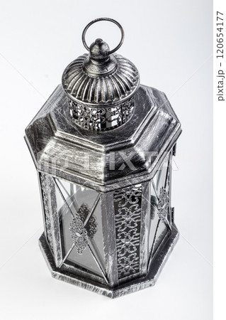 Beautiful vintage metal lantern on a white background 120654177