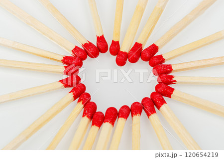 matchstick with a red heart-shaped head on a white background 120654219