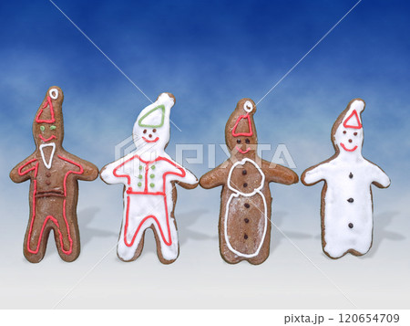 Four gingerbread cookie figures 120654709