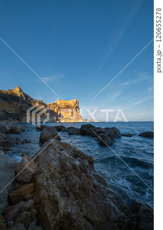 The rock rises above the blue sea The rock rises above the blue sea 120655278