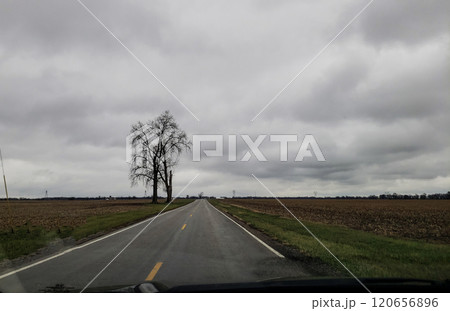 Lonely Country Road During a Cloudy Day in Autumn, Madison County, Ohio 120656896