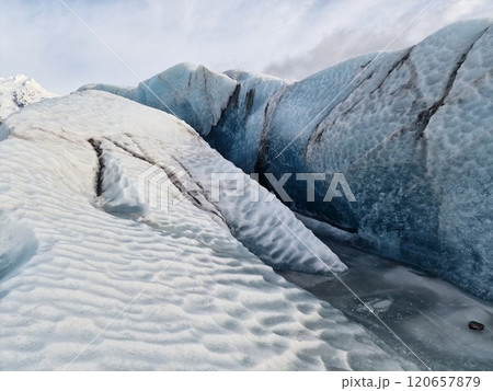 Spectacular vatnajokull ice caves in nordic region, creating majestic icelandic landscape glacier lagoon. Beautiful arctic scenery with massive transparent cracked icebergs. Spectacular vatnajokull ice caves in nordic region, creating majestic icelandic landscape glacier lagoon. Beautiful arctic scenery with massive transparent cracked icebergs. 120657879