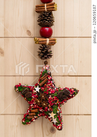 Star-Shaped Christmas Decoration with Pinecones and Cinnamon Star-Shaped Christmas Decoration with Pinecones and Cinnamon 120659187