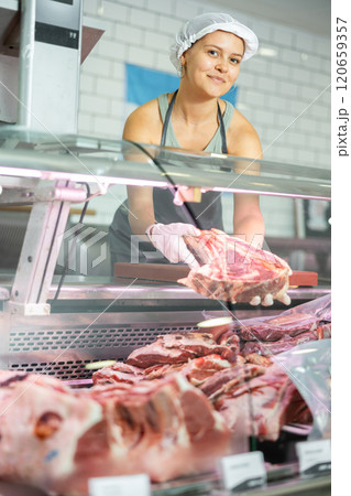 saleswoman expertly showcases selection saleswoman expertly showcases selection 120659357