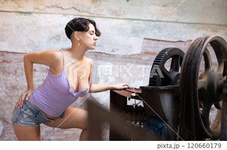 Desirable of woman in derelict factory 120660179